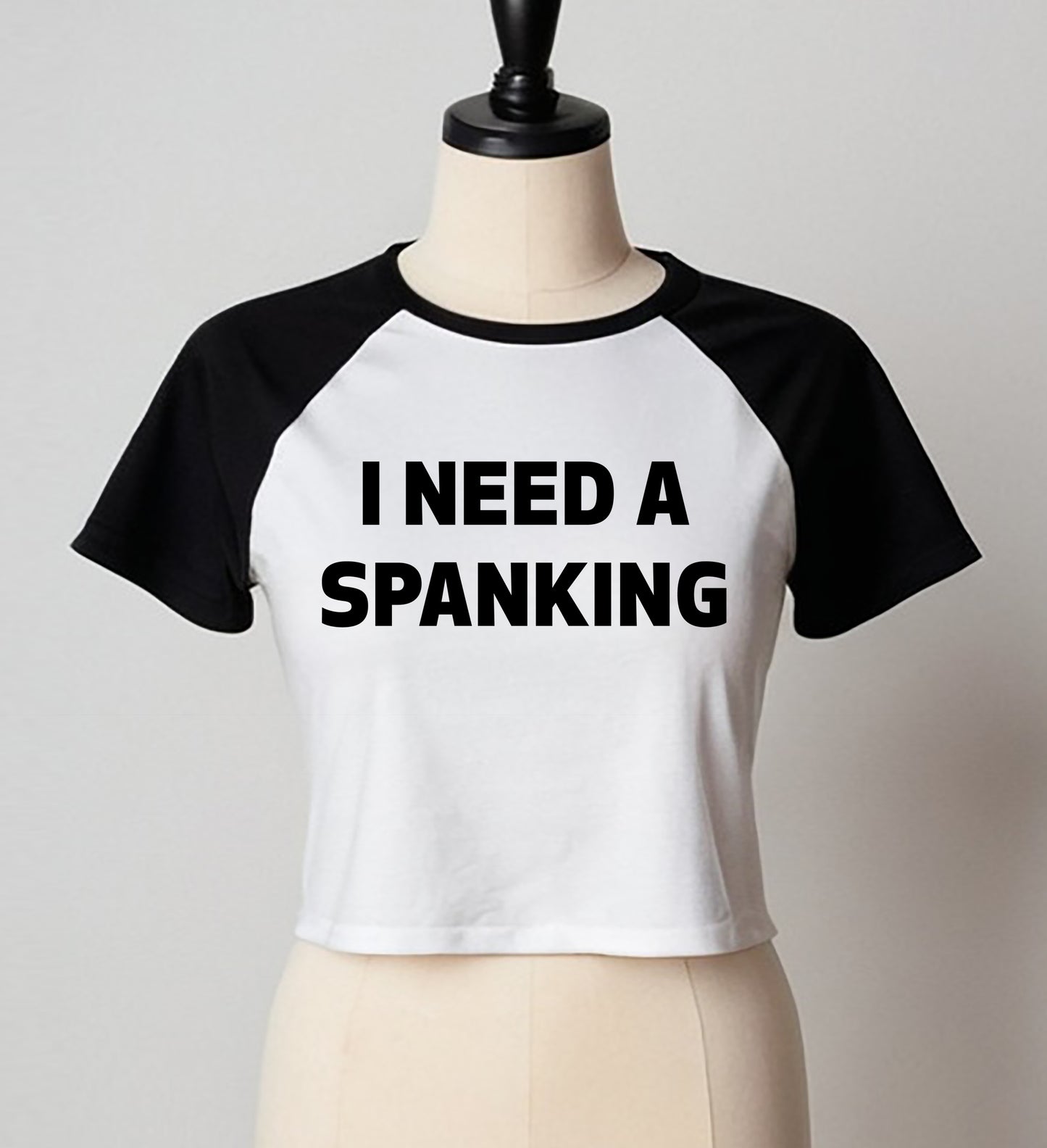 I NEED A SPANKING | LADIES RAGLAN CROP TOP