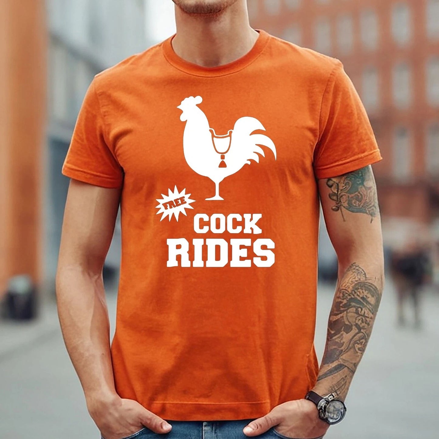 FREE COCK RIDES COCK PRINT | FUNNY MEN'S T-SHIRT ORANGE T-SHIRT WHITE PRINT FREE COCK RIDES COCK PRINT | FUNNY MEN'S T-SHIRT